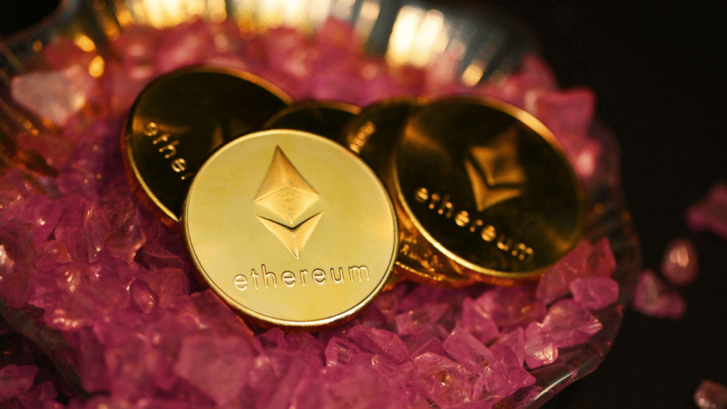 Five Ethereum coins placed on pink crystals.