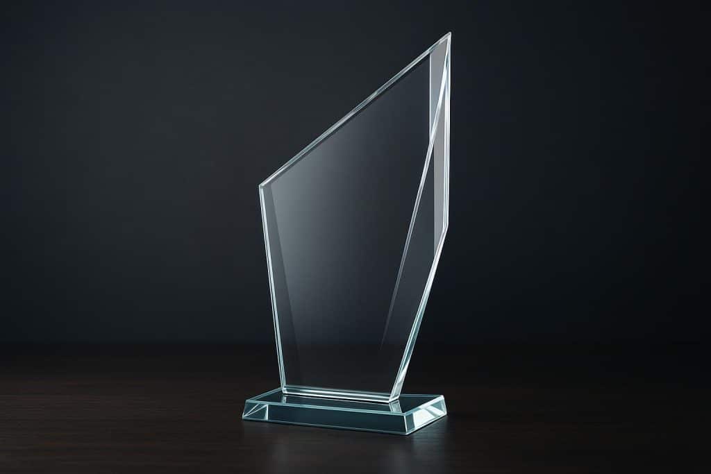 Beyond the Plaque: How Tech is Creating Stunning, Modern Glass Trophies Modern glass trophies with intricate designs created using advanced technology on display