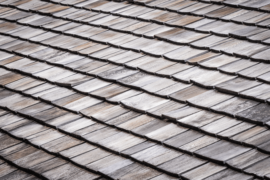 Image 1 of A skilled roofer can match shingles, reseal flashings, and replace damaged sections to extend the life of the existing roof without major disruption or expense.