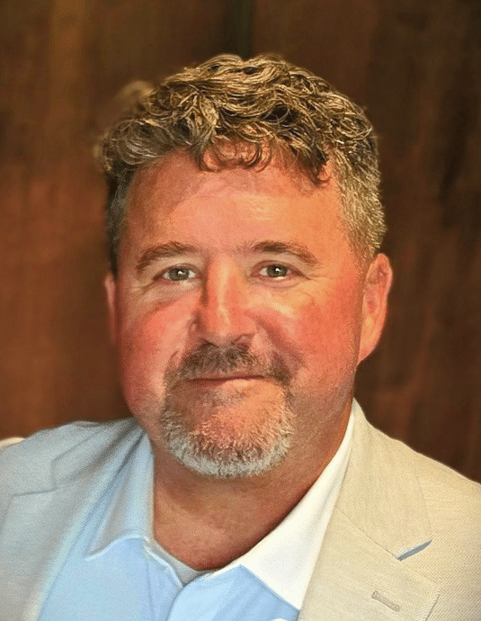 A person with a beard and mustacheAI-generated content may be incorrect.