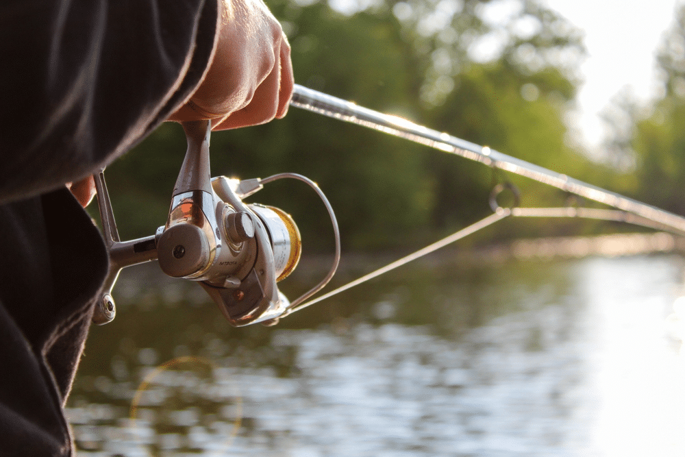 Saltwater fishing boat on the ocean with gear, highlighting tips for a successful fishing trip