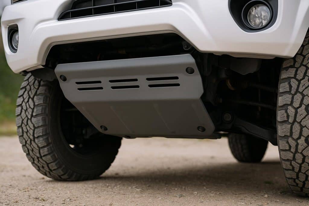 Underbody view of a car with skid plate installed for protection against road debris and damage