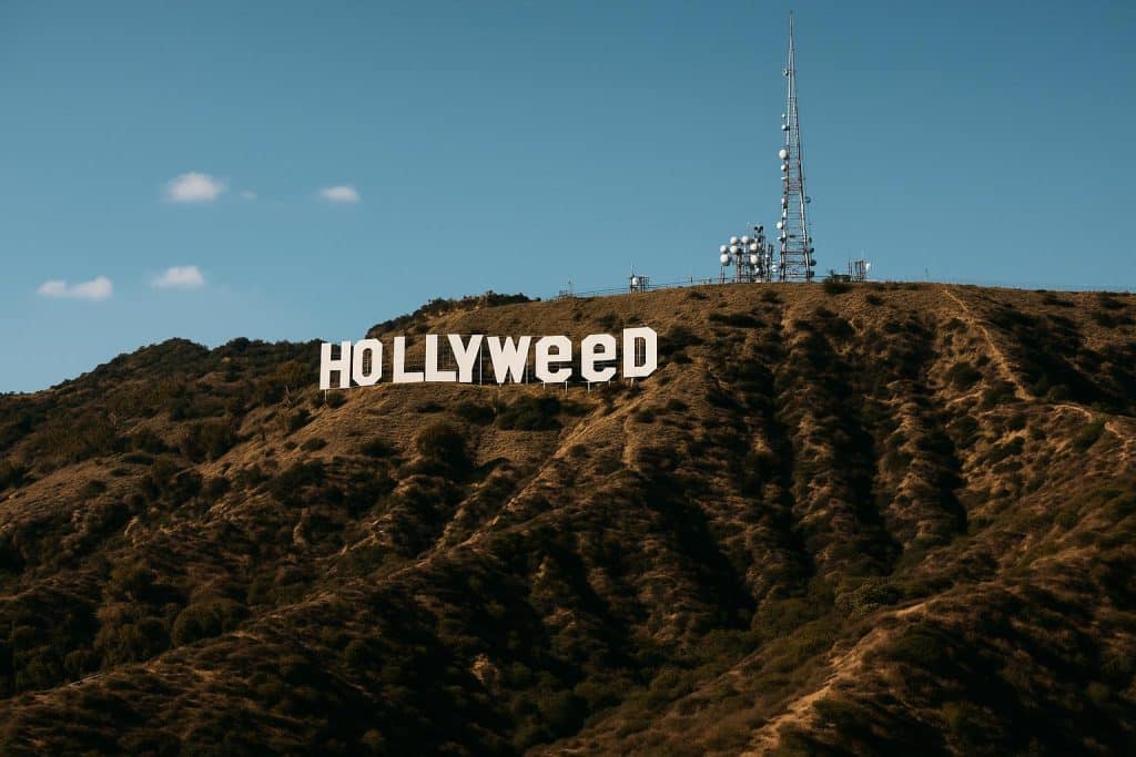 Iconic Hollywood Hills “Hollyweed” sign overlooking Los Angeles with urban streetwear elements